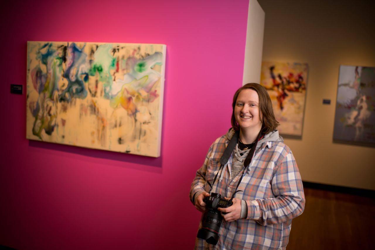 Student standing in gallery